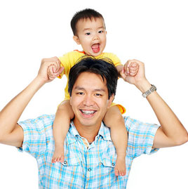 stock photo of a dad with braces and baby